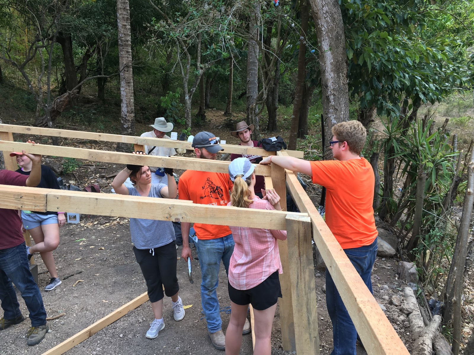 ewb-photo.jpg In Guatemala, students build a wooden structure that will protect water tanks.