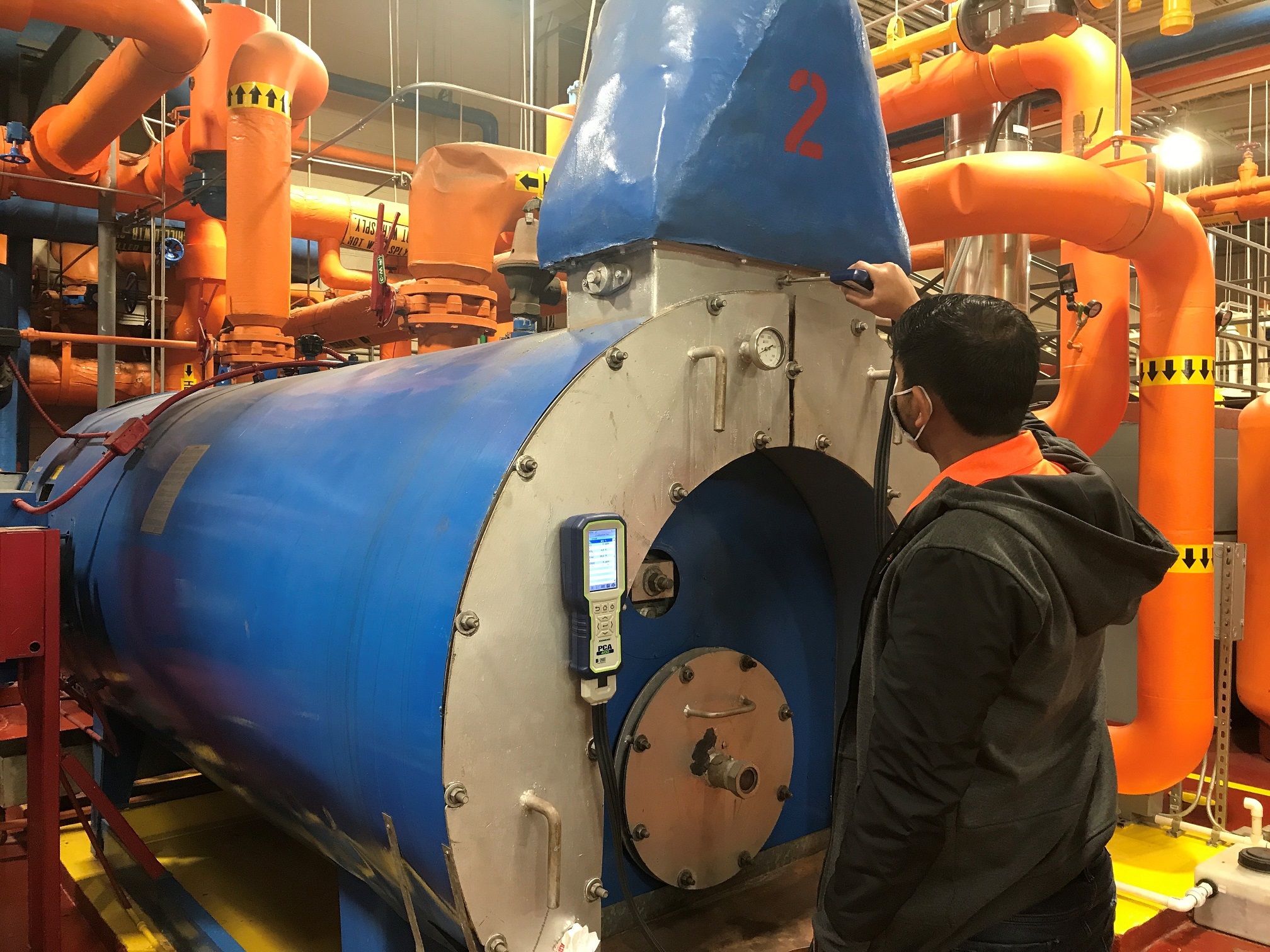 iac-2.jpg A student examines a large compressor.
